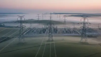 Editorial image: Dawn transmission grid landscape - UK's $4B Grid Project Could Signal US Infrastructure Opportunities