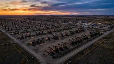 Editorial image: Aerial pumpjack field dusk - Alberta's 120-Day Approval Rule for Major Projects Could Accelerate Energy Work Backlog