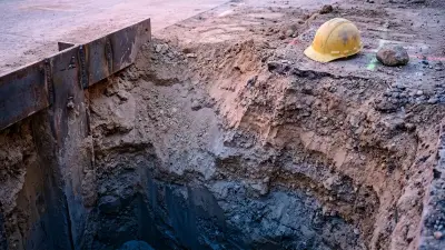 Editorial image: Empty trench at dawn - Massachusetts Contractor's $4.7M Fine Shows How Repeat Trench Violations End Businesses