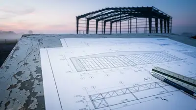 Editorial image: Defence blueprints at dawn - AECOM Lands Top Spot on $270M Defence Construction Canada A&E Source List
