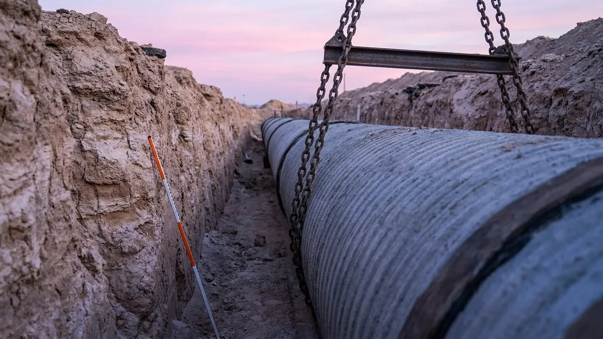 Editorial image: Pipe lowered into desert trench - SNWA's $2.7 Billion Horizon Lateral Pipeline Moves Forward After Federal Approval