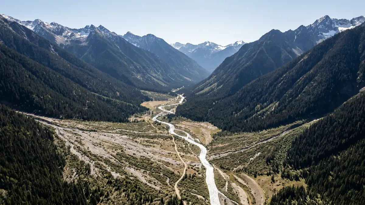 Editorial image: BC wilderness pipeline corridor aerial - Alberta Energy Minister Confirms Fortune 500 Talks to Finance 1 Million Bbl/d Pacific Pipeline
