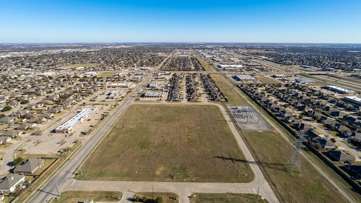 Editorial image: Vacant lot awaits city verdict - Broken Arrow Weighs Six-Month Data Center Moratorium as Council Cites Infrastructure Strain