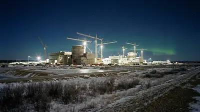 Editorial image: Nuclear plant construction at night - Canada Plans Up to 10 New Nuclear Reactors in $100 Billion-Plus Build Program