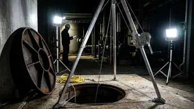 Editorial image: Confined space rescue rigging, night - Confined Space Rescue Plans Have Critical Gaps, Industry Experts Warn