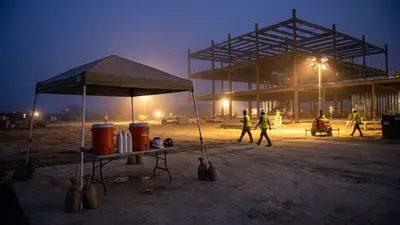 Editorial image: Night hydration station, heat wave - Early Heat Wave Exposes Acclimatization Gap on Construction Sites