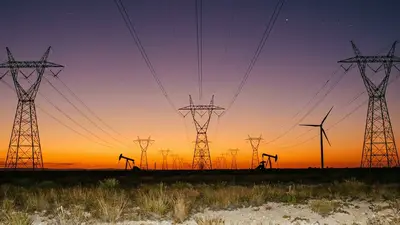 Editorial image: Transmission towers, Permian dusk - NextEra Commissions 137-Mile Crossroads-Hobbs-Roadrunner Transmission Line in SE New Mexico