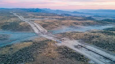 Editorial image: Pipeline corridor at dawn - South Bow and Bridger Plan New Oil Pipeline from Wyoming to Cushing, Completing Three-Leg Alberta-to-Hub Corridor