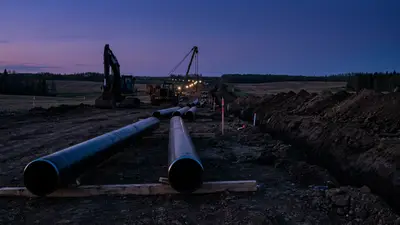 Editorial image: pipeline right-of-way staged at dusk - AUC Approves $2.9B Yellowhead Gas Pipeline, Construction Starts Immediately in Alberta