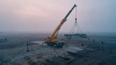 Editorial image: modified crane, unstable ground, dawn aerial - Certification Confirms Function, Not Design Limits, Safety Expert Warns