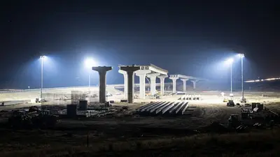 Editorial image: Nighttime interchange construction under floodlights - OTA Awards $75.4M Contract for Toby Keith Expressway Interchange Near Newcastle