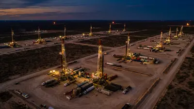Editorial image: Aerial view multiple active rigs - US Rig Count Hits 15-Month High on Fifth Straight Weekly Gain