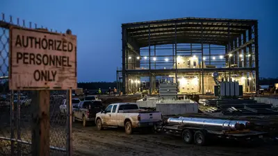 Editorial image: gas power plant construction at dusk - Williams Lands $5.34B Blackstone-Led Investment for Gas-Fired Power Projects