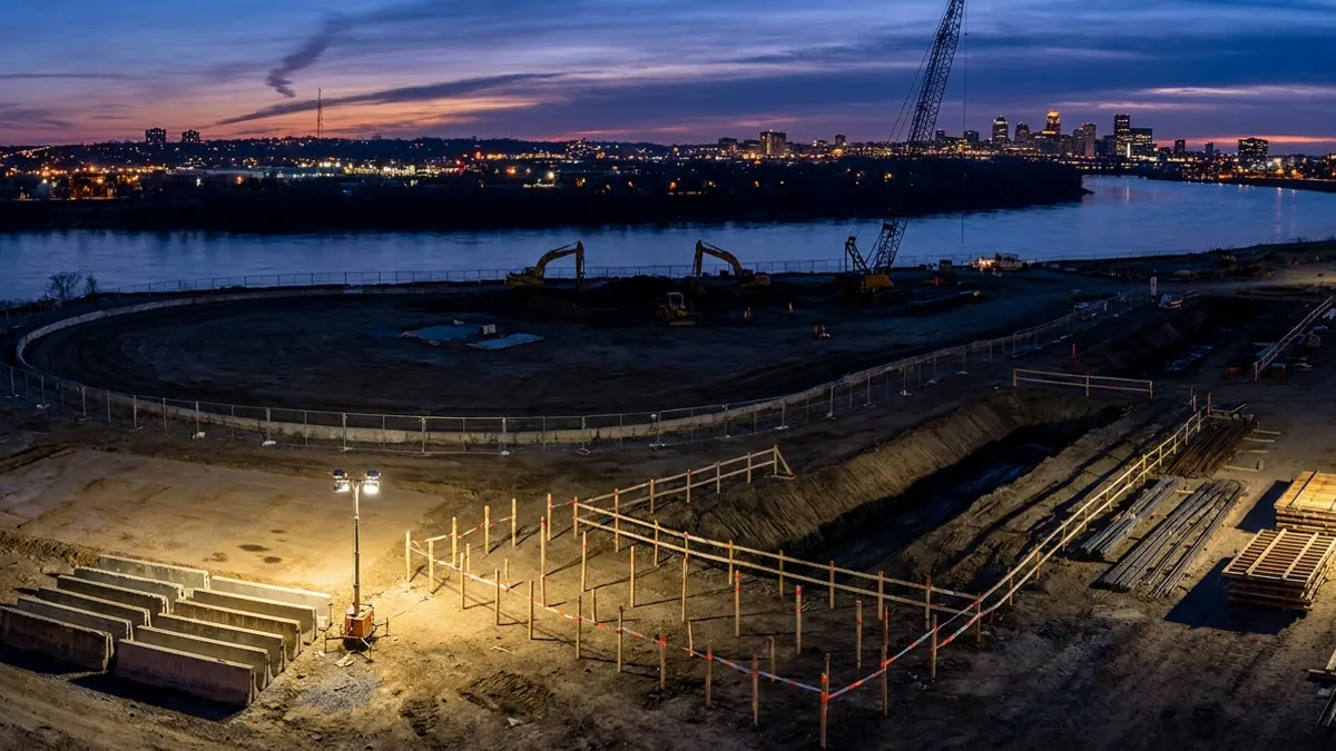 Editorial image: riverside stadium site at dusk - Clark/Mortenson/Smoot JV Wins $3.8B Commanders Stadium Job