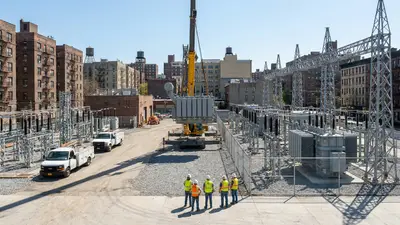 Editorial image: Urban substation construction against NYC skyline - ConEd Ups Substation Plan to 28, Backs $37.2B Grid Spend Through 2035
