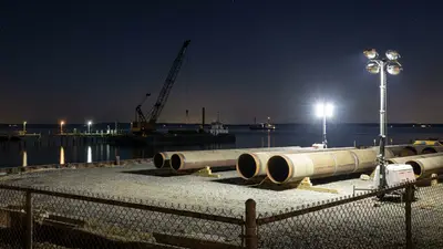 Editorial image: Pipeline staging yard at night - Court Upholds NY Water Permit for Williams' $1B Gas Pipeline