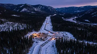 Editorial image: Aerial dusk pipeline corridor through BC wilderness - Enbridge, KKR, Apollo Form C$2.7B JV for BC Pipeline Expansions