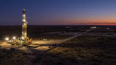 Editorial image: Multi-well horizontal drilling program, dusk desert - EON Kicks Off 92-Well Horizontal Drilling Program in New Mexico