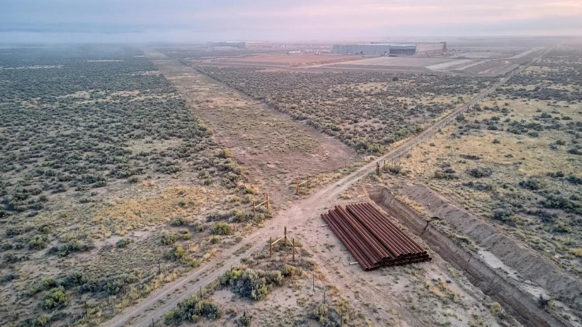 Editorial image: Stalled pipeline right-of-way at dawn - Gas Pipeline Delay Pushes Back Oracle's $165B New Mexico Data Center