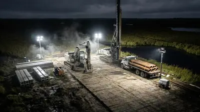 Editorial image: Night staging yard on marshland - SpaceX's $100B Louisiana Spaceport Plan Signals Years of Field Work Ahead