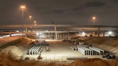 Editorial image: Nighttime Texas highway megaproject construction - Texas Approves $138B Decade-Long Transportation Investment Plan