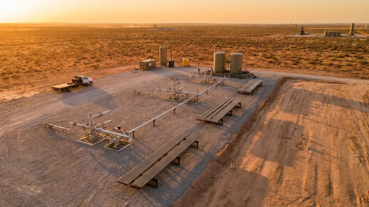 Editorial image: Permian well pad plus solar site - UK Firm Redirects Capital to Permian, Calls Home Market Uninvestable