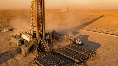 Editorial image: Aerial multi-rig basin at golden-hour - US Rig Count Climbs to 593 as Oklahoma Adds Rig