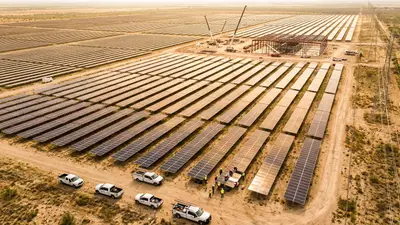 Editorial image: Aerial solar farm meets data center construction - EIA: Solar Generation to Jump 21% in 2026 on Data Center Demand