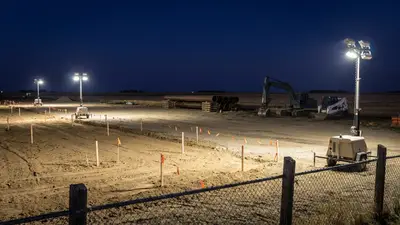 Editorial image: Night groundbreaking, pipe staging, rural site - Enhance Energy Breaks Ground on Canada's Largest Carbon Capture Hub in Alberta