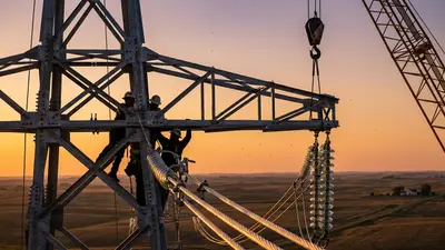 Editorial image: HVDC tower steel erection close-up - Mortenson to Build $450M HVDC Line Upgrade Across North Dakota, Minnesota