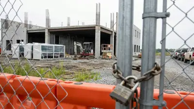 Editorial image: Padlocked data center construction site - Data Center Pauses Are a Cash-Flow Risk Your Subcontract May Not Cover