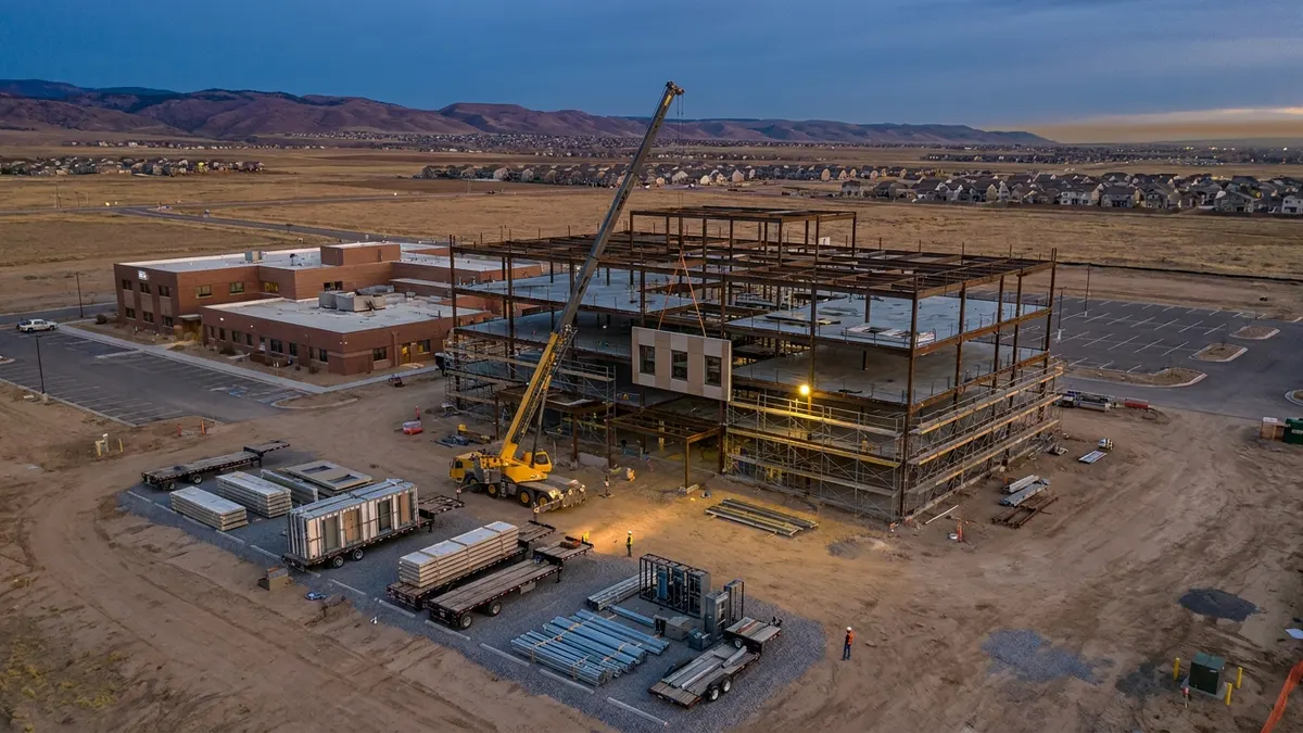 Editorial image: Prefab healthcare build aerial dusk - DPR to Prefab Steel, Facades and MEP on $230M Kaiser Colorado Build